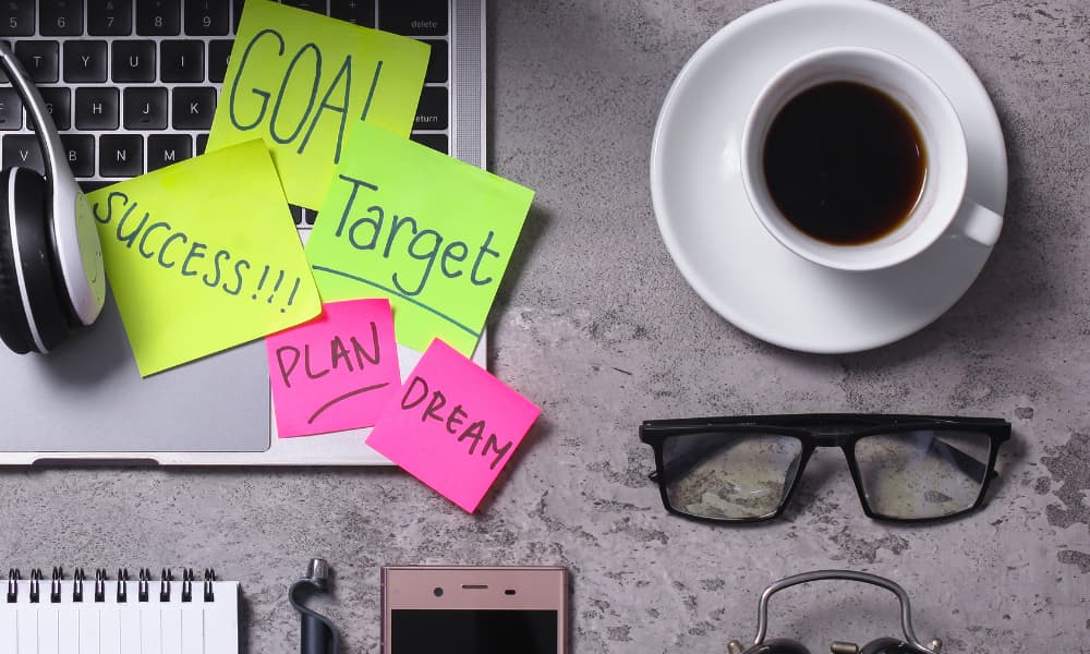 Notebook listing SMART goals for tracking performance