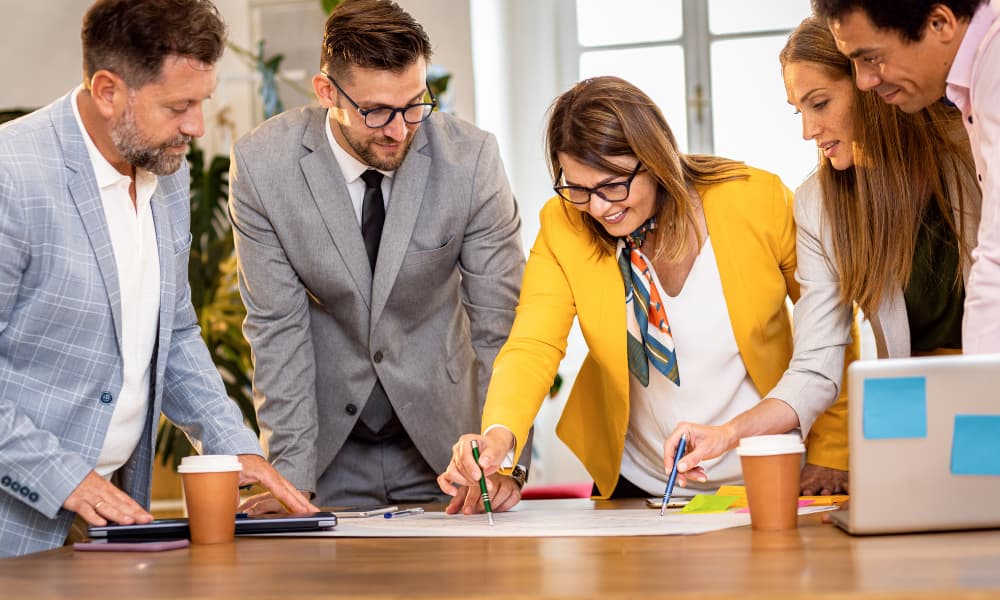 office employees working on MSP pricing strategy