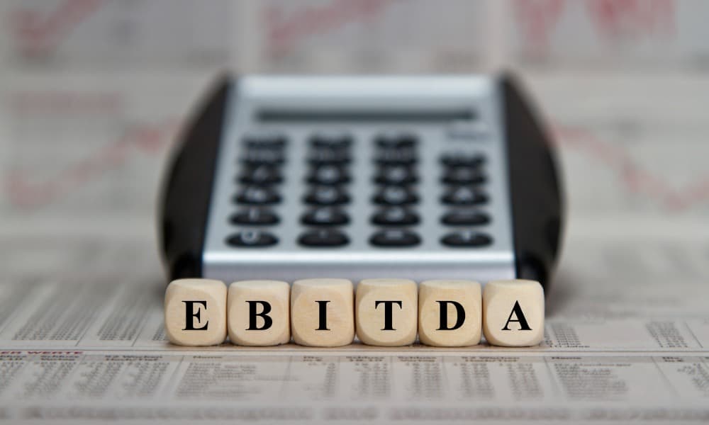 The abbreviation ebitda in wooden tiles.