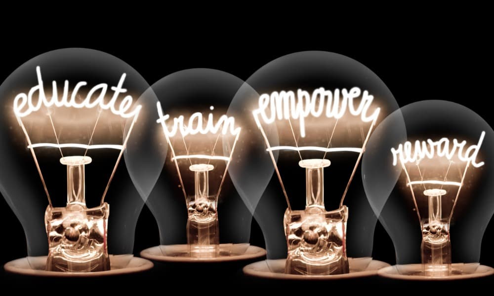 Four lightbulbs with the words “educate,” “train,” “empower,” and “reward.”