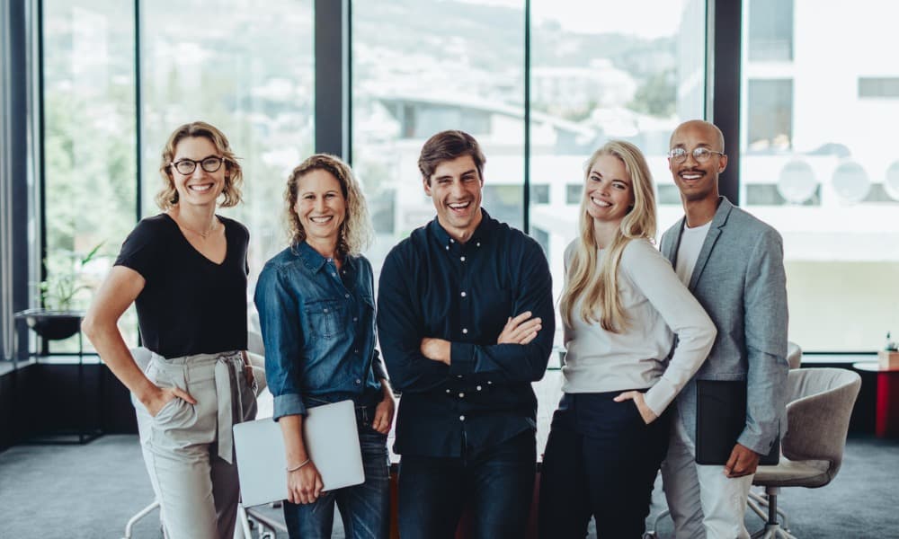 A group of employees smiling