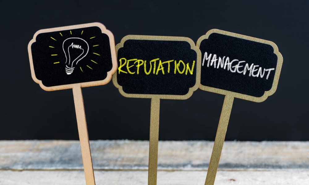 Reputation management written with chalk on wooden blackboards.