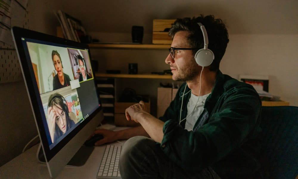 A remote team having a video conference call to encourage team building.